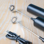 Detail of Tea Squared milk frother whisk heads and charging cable