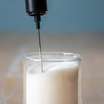 Close-up of the Tea Squared whisk frothing milk