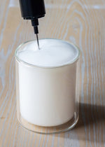 Tea Squared electric whisk creating milk foam